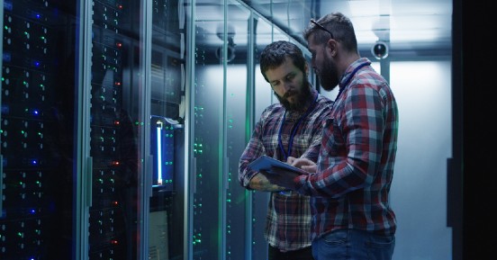 Two men diagnosing server hardware